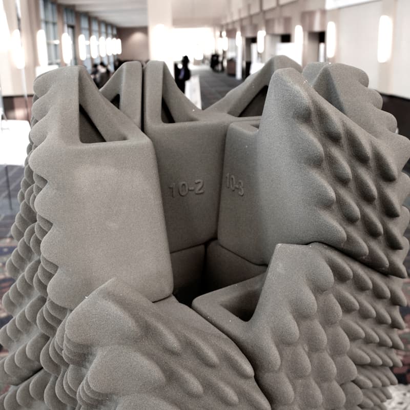 3D printed building model undergoing earthquake simulation testing on shake table