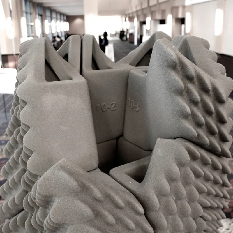 3D printed building model undergoing earthquake simulation testing on shake table