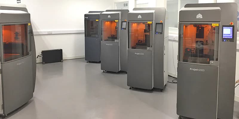 Industrial stereolithography laboratory featuring multiple 3D Systems ProJet 6000 and 7000 machines