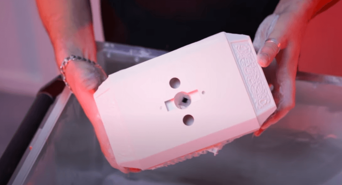 Thor's hammer Mjolnir showing intricate Norse symbols and detailed surface texturing achieved through SLS 3D printing