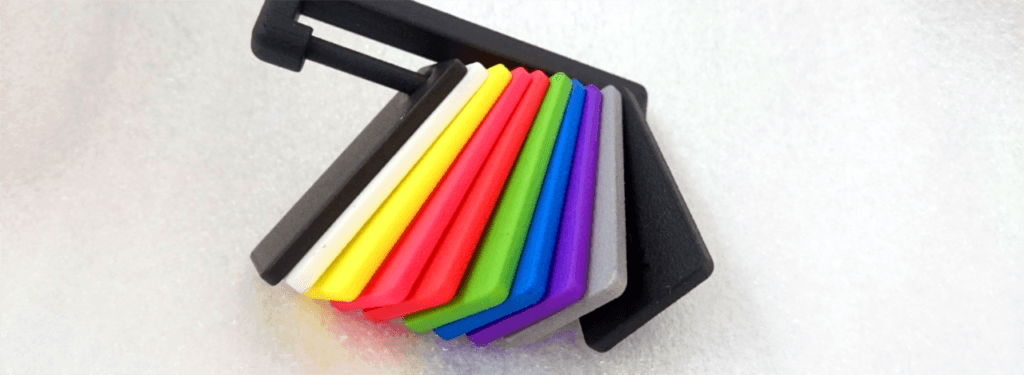 Colorful SLS parts showing various dye colors achievable