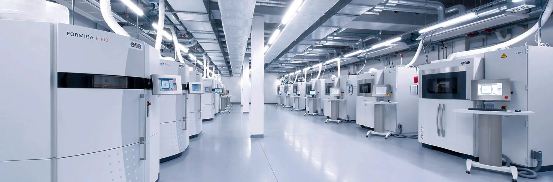 Engineers reviewing SLS production jobs on the Forge Labs factory floor