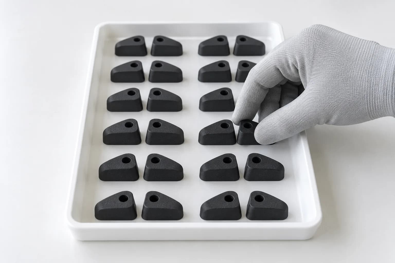 Handed SLS nylon bump stops in matched left- and right-hand pairs