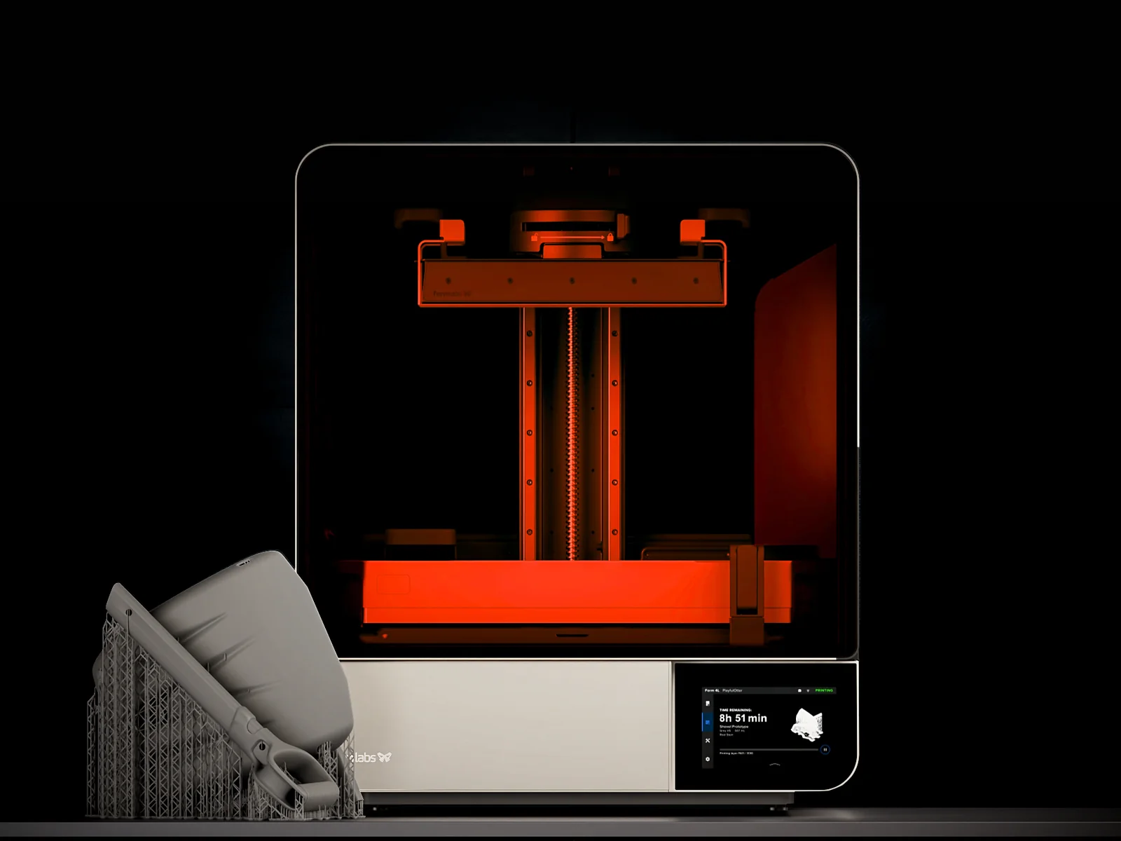 Formlabs Form 4L large-format SLA printer with a large printed part on its supports beside it