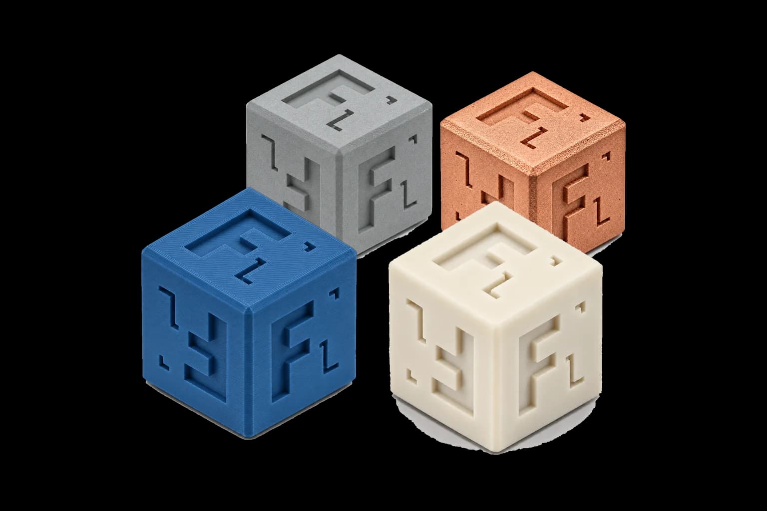 Forge Labs sample cubes in MJF nylon, DMLS copper, FDM ABS and SLA resin