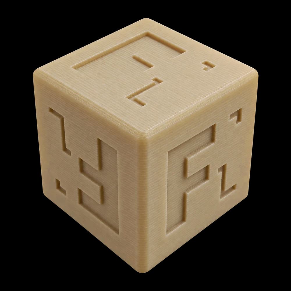 Forge Labs sample cube in natural amber FDM Antero 800NA PEKK