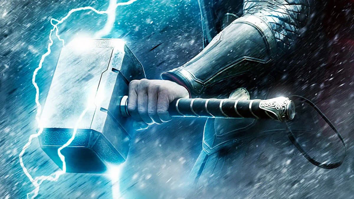 Thor wielding Mjolnir in action, showcasing the prop's durability and realistic appearance in film