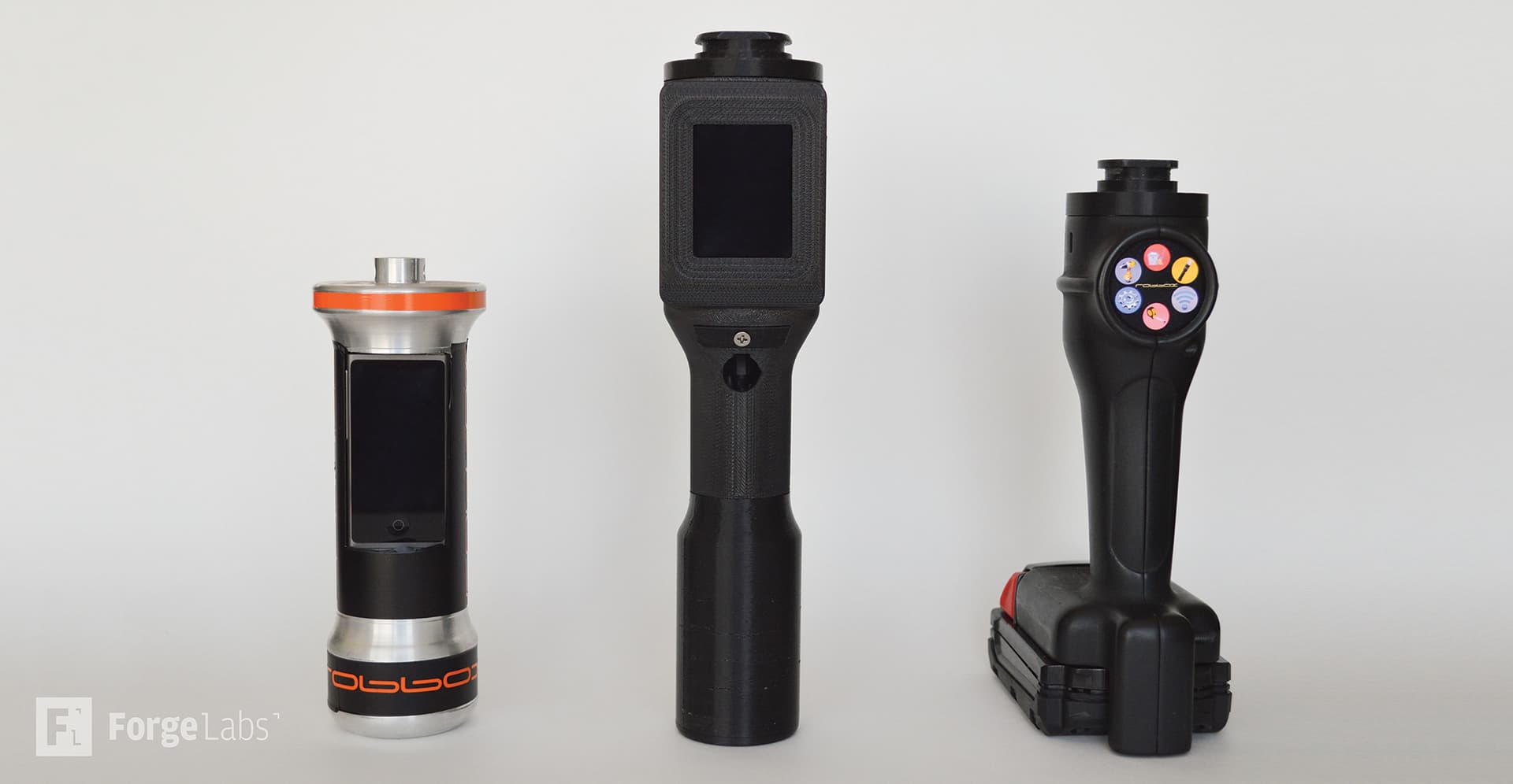 Multiple iterations of 3D printed drill and driver enclosures showing rapid prototyping evolution