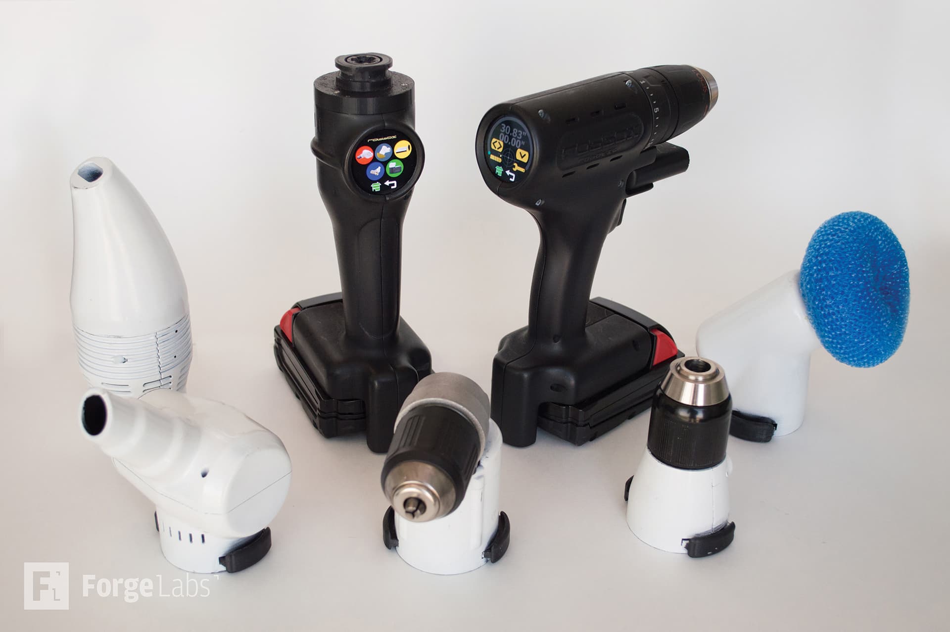 Array of 3D printed tool attachments and drill heads showing modular design system