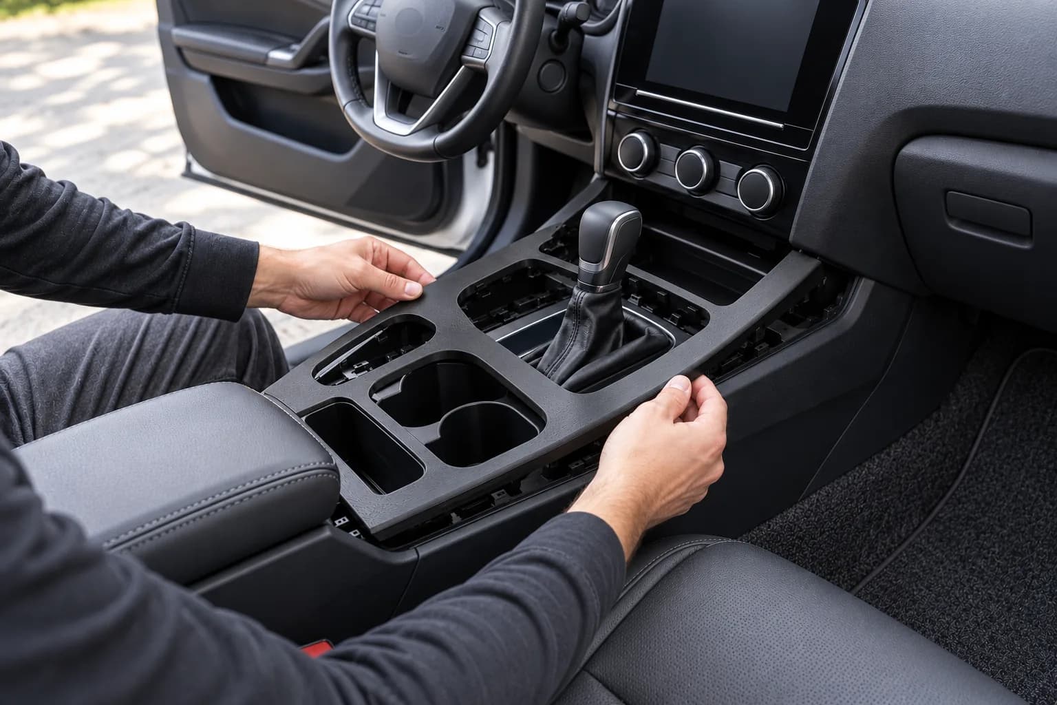 Black FDM console trim panel fitted in a car interior