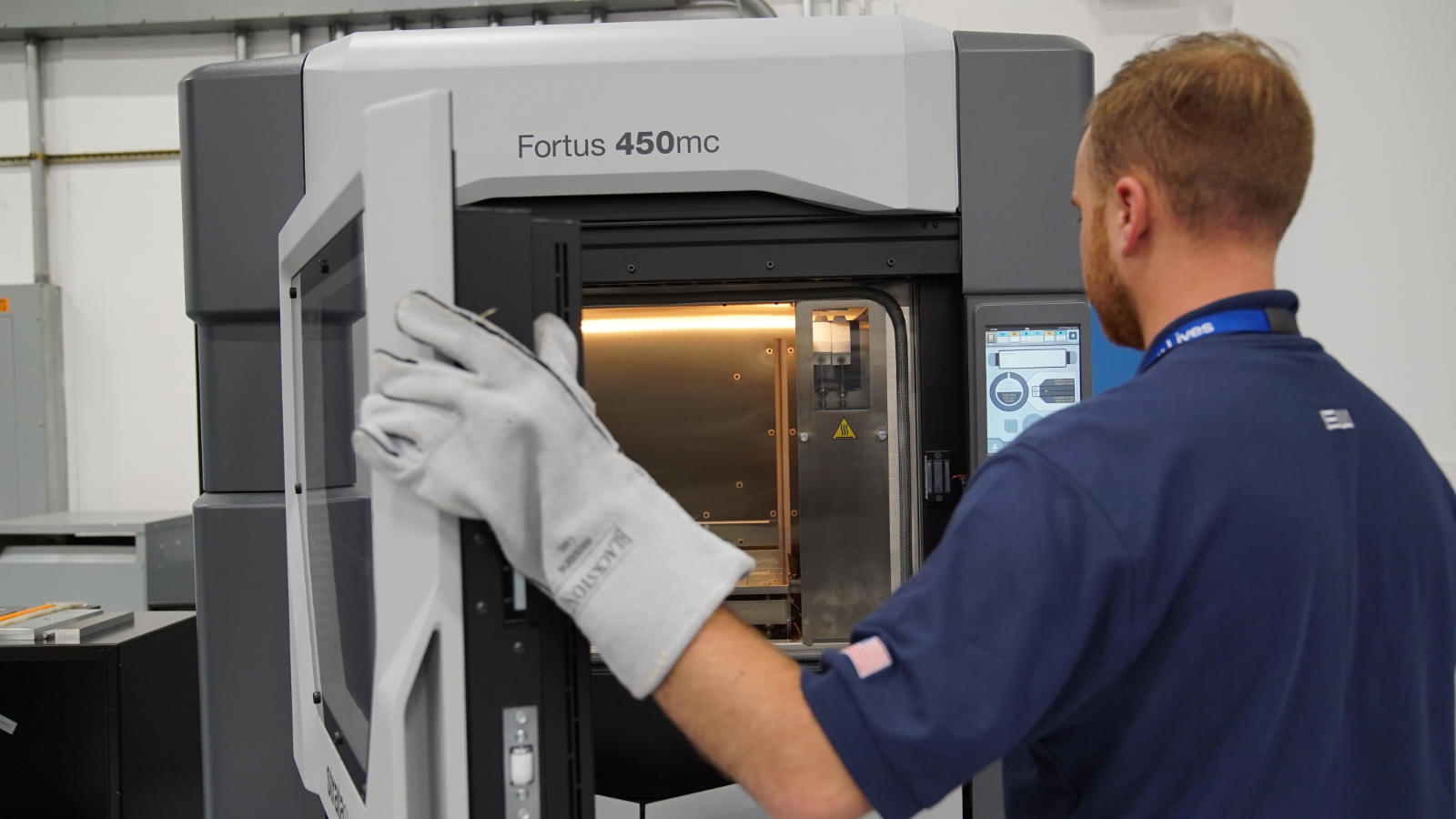 Interior view of Stratasys Fortus 450 build chamber showing heated environment and precision mechanics