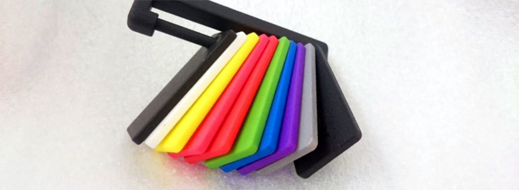 Colorful SLS parts showing various dye colors achievable