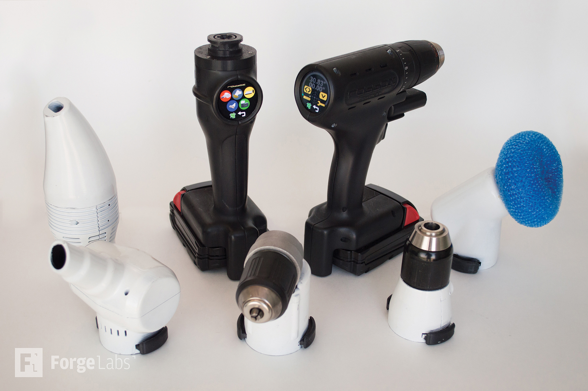 Array of 3D printed tool attachments and drill heads showing modular design system