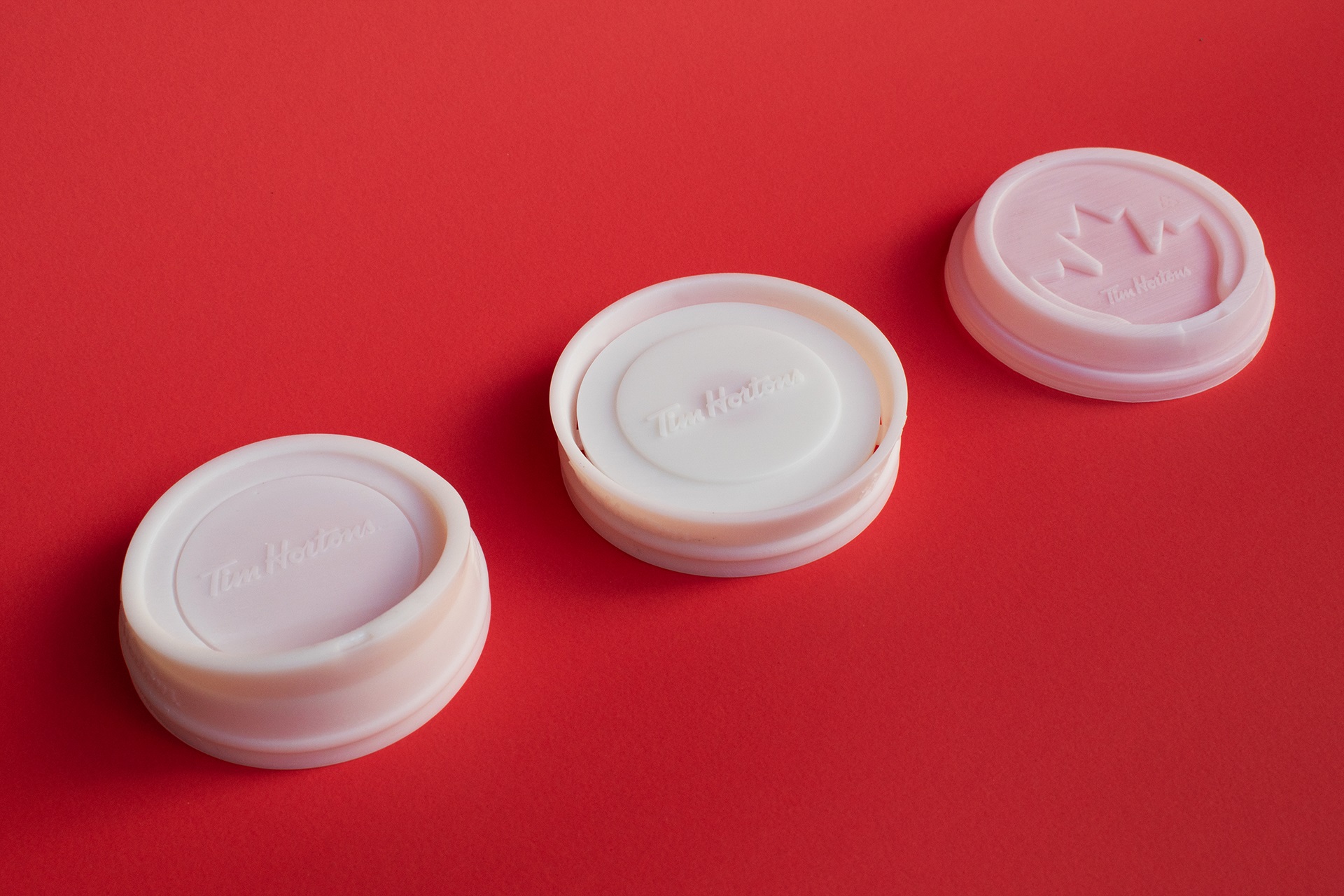 Multiple SLA-printed prototype iterations showing design evolution